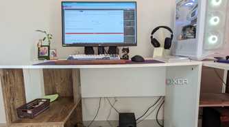 Gaming PC setup showing a mess of cables under the desk