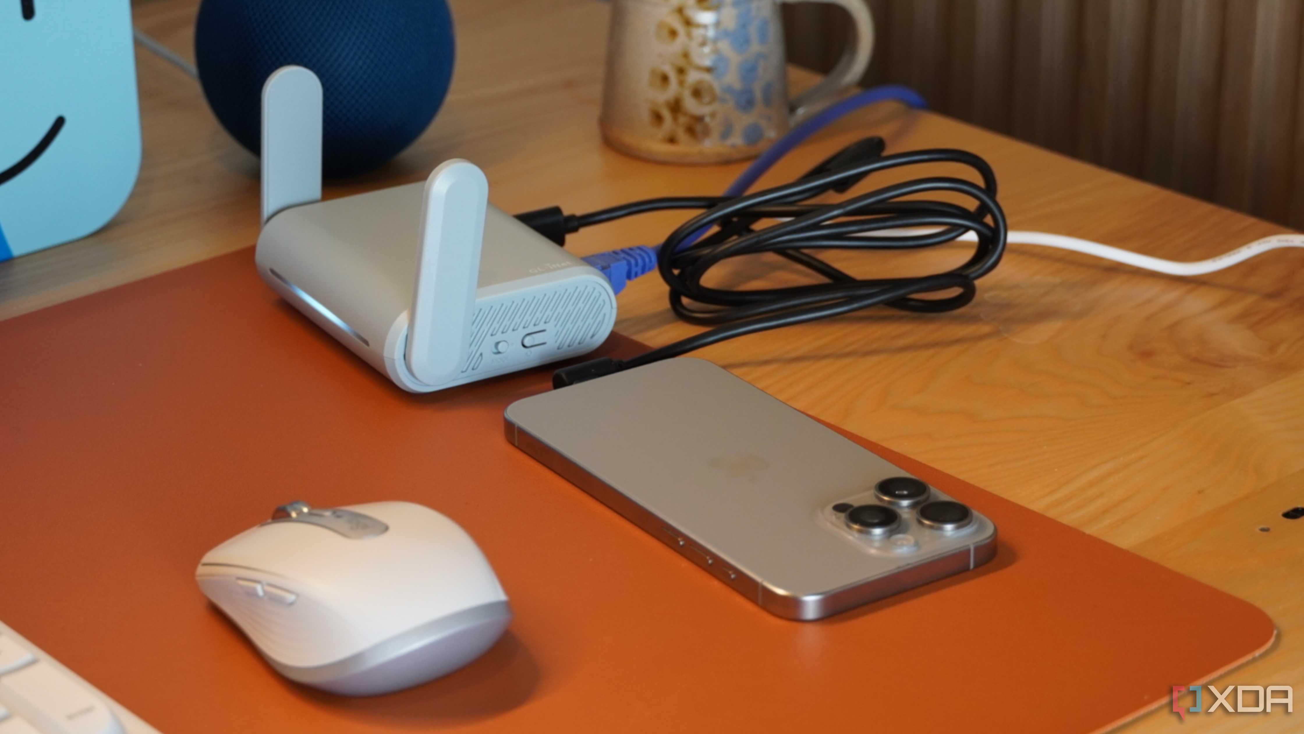 An iPhone connected to a travel router.
