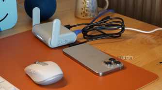 An iPhone connected to a travel router.