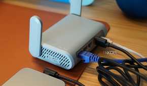 An iPhone connected to a travel router.
