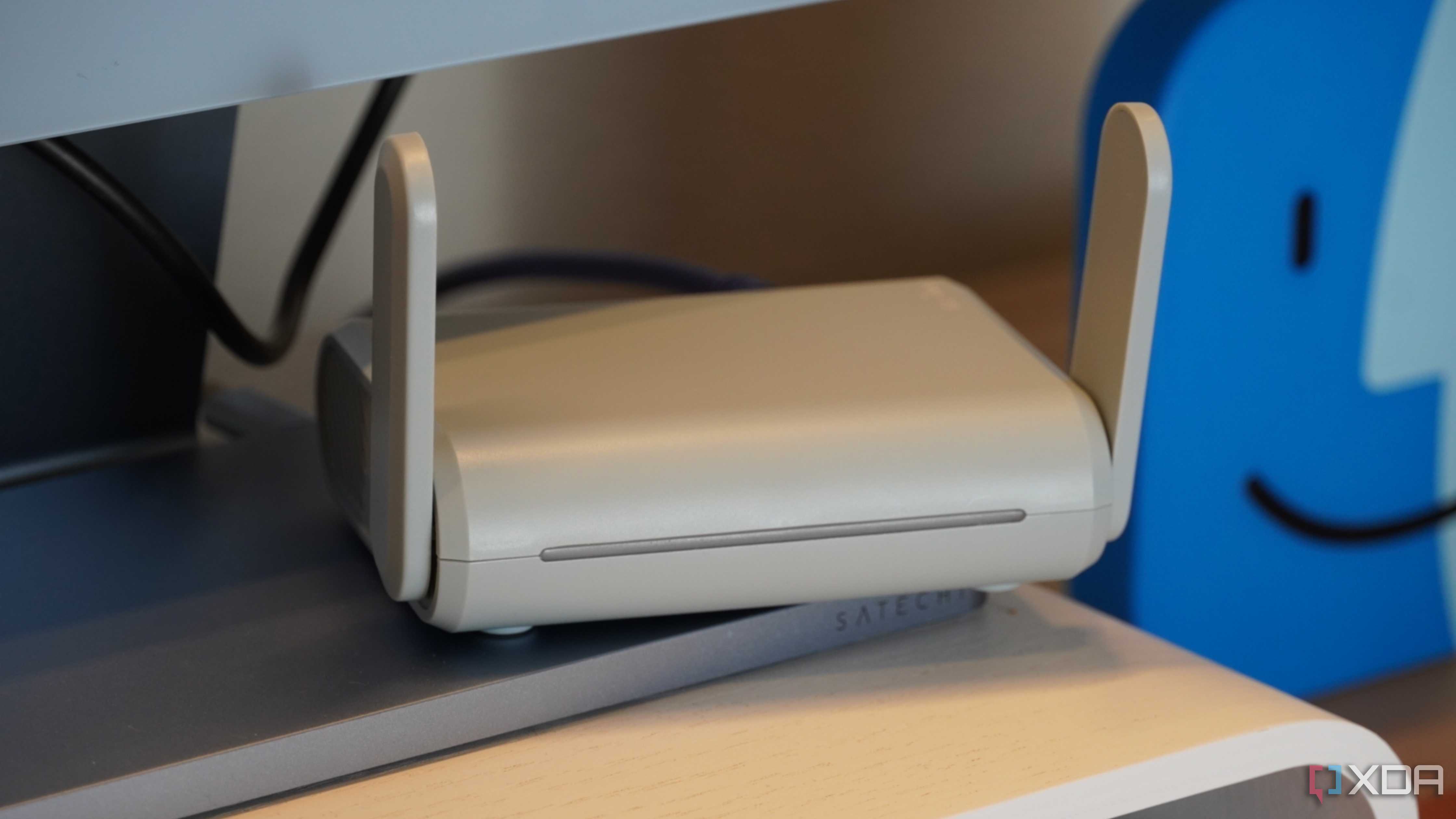 The Beryl travel router on a desk.