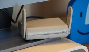 The Beryl travel router on a desk.