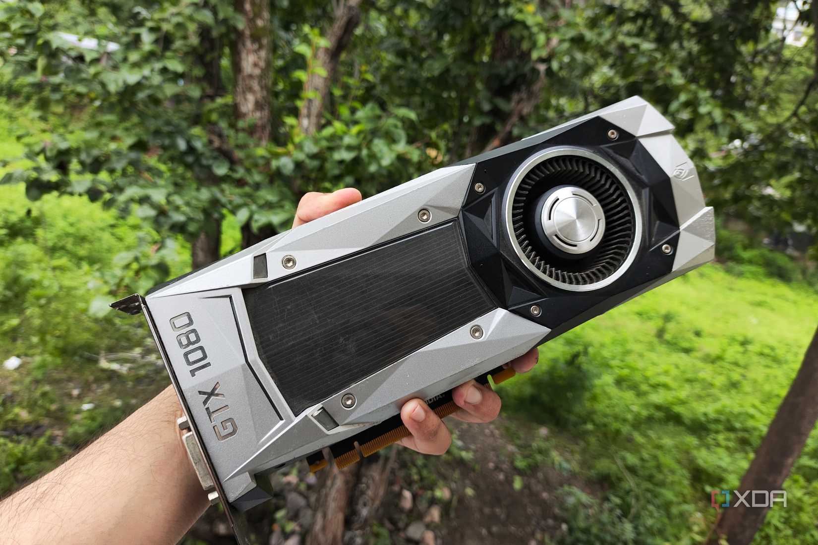 An image of a GTX 1080 in a user's hand