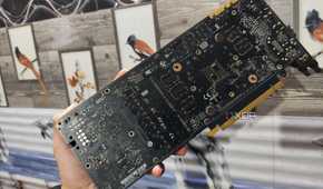 A person holding a GTX 1080 without its backplate