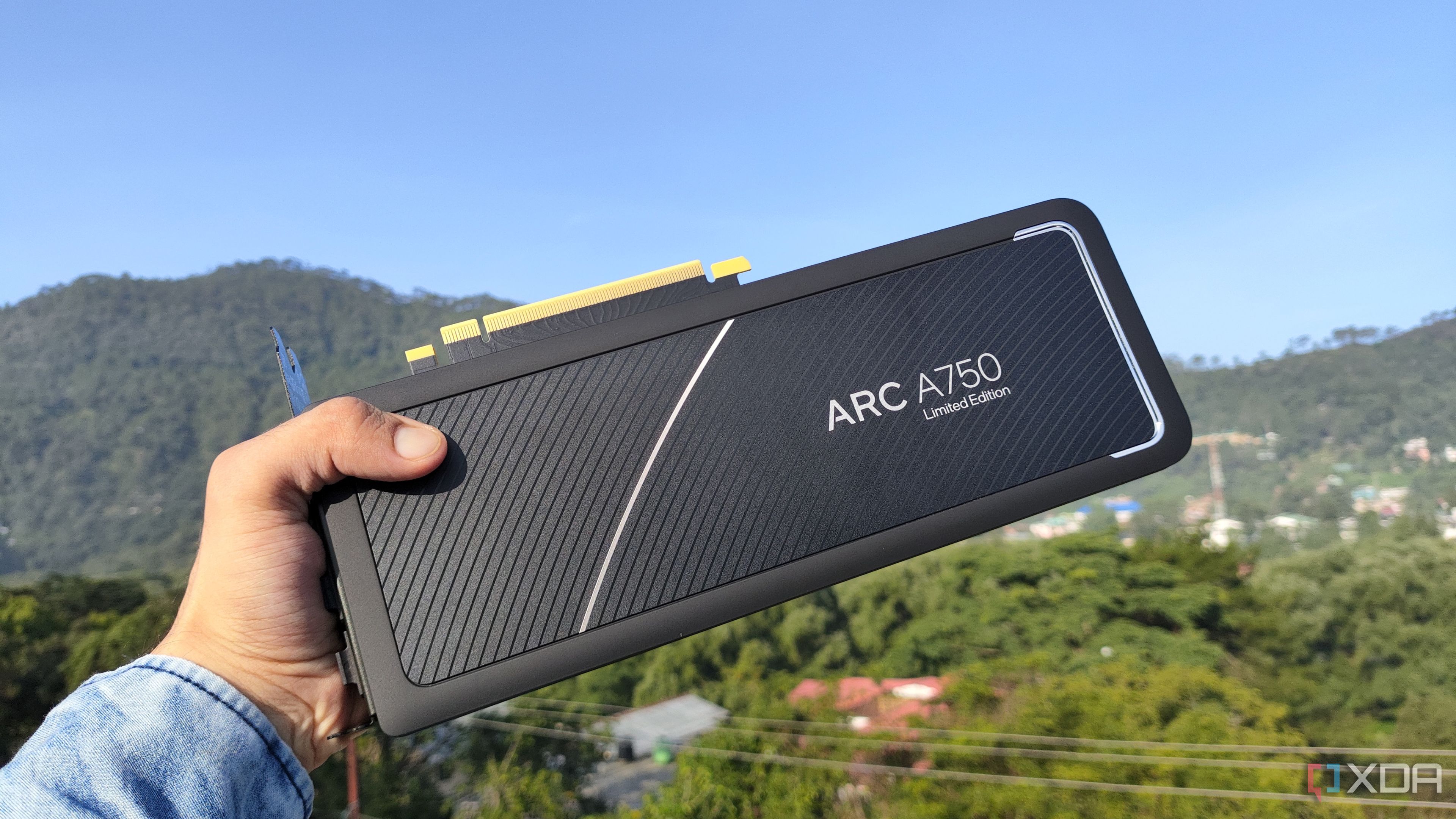 A person holding an Intel Arc A750