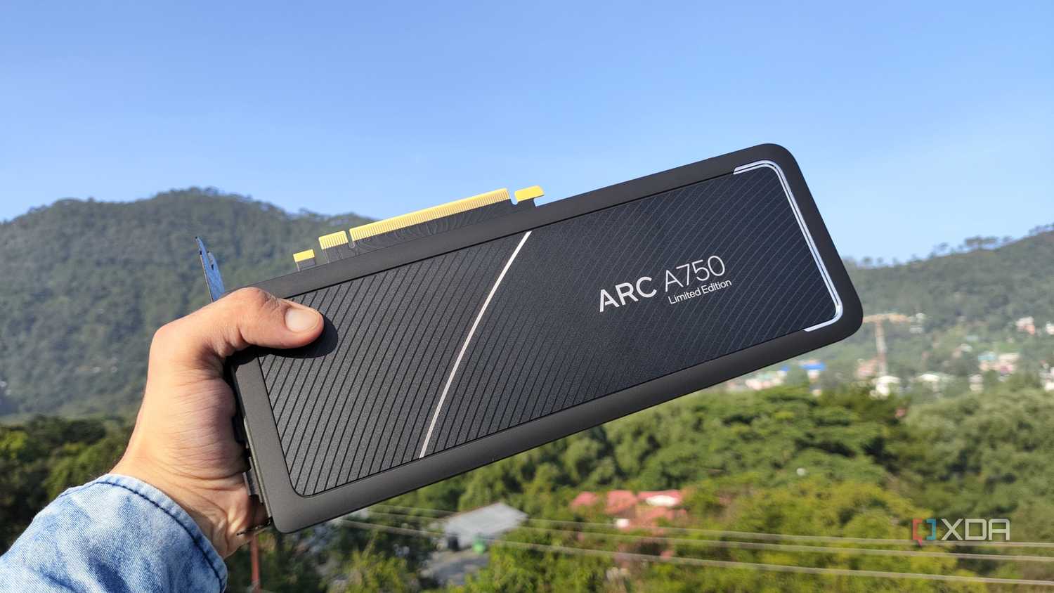 A person holding an Intel Arc A750