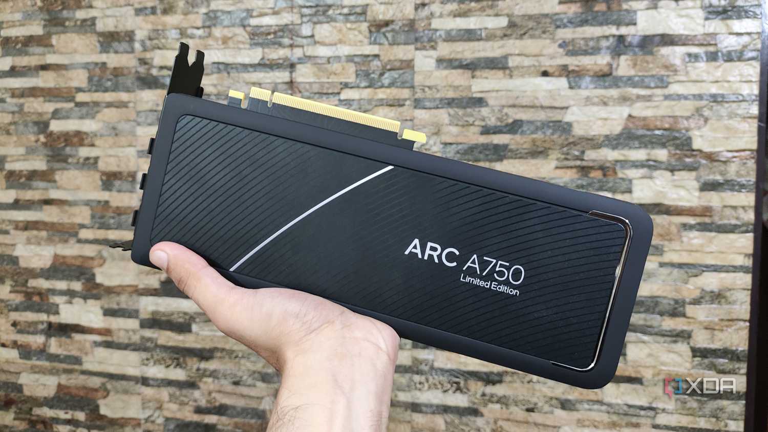 A person holding an Intel Arc A750