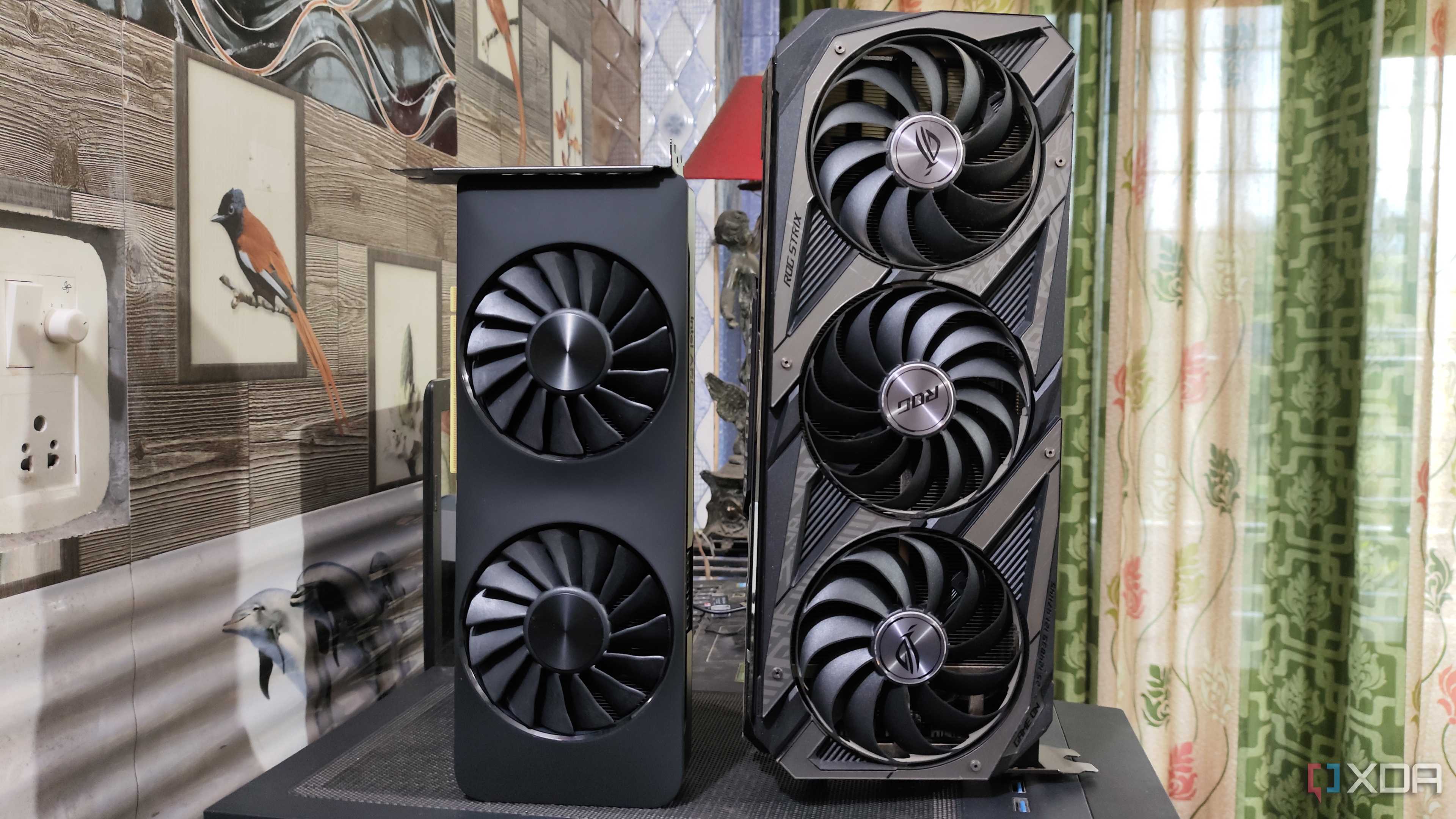 An Intel Arc A750 placed next to an ASUS Rog Strix RTX 3080 Ti