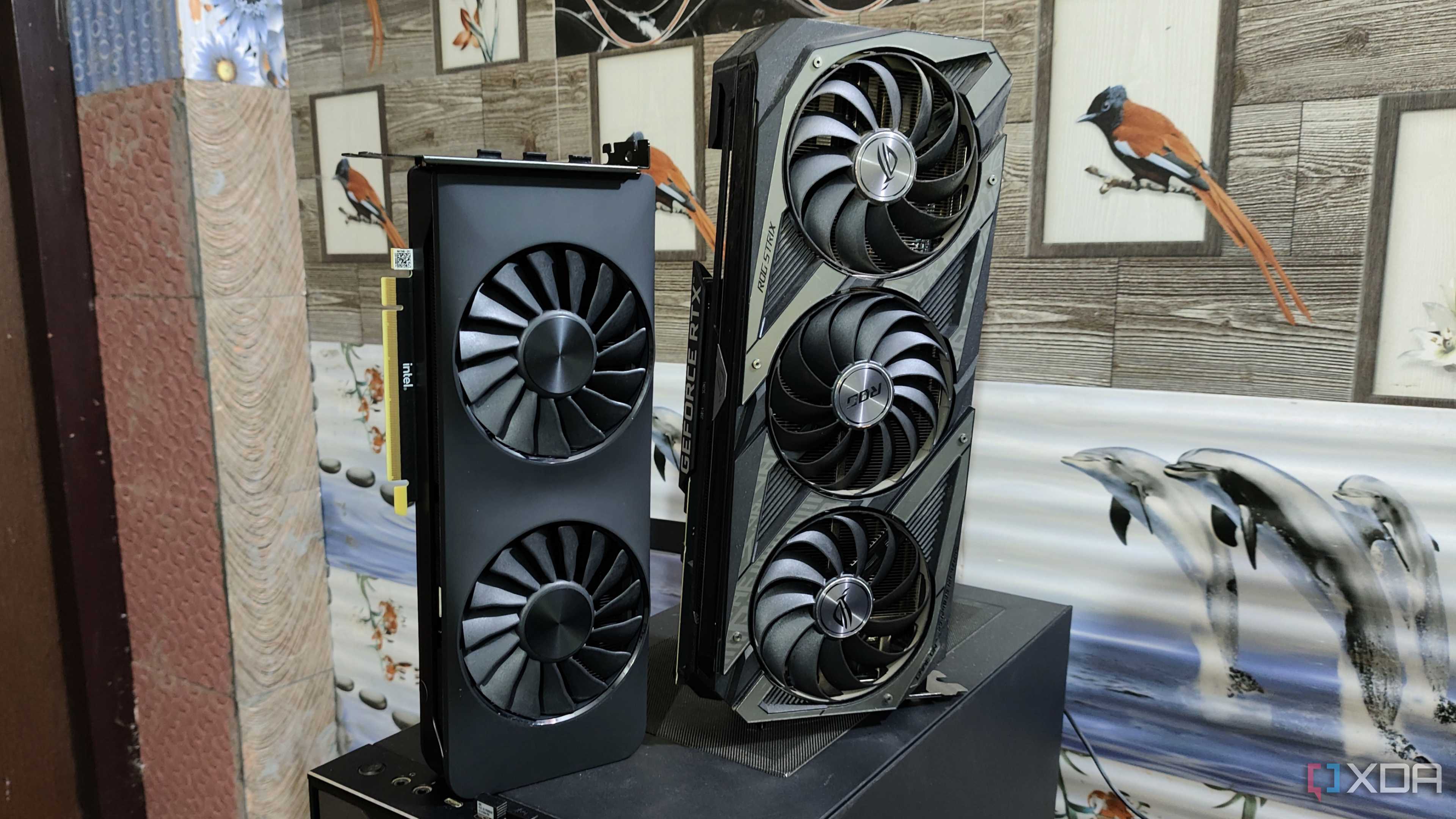 An Intel Arc A750 placed next to an ASUS Rog Strix RTX 3080 Ti