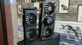 An Intel Arc A750 placed next to an ASUS Rog Strix RTX 3080 Ti