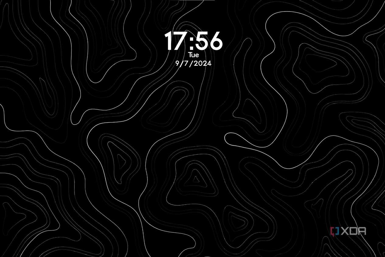 A wallpaper with white curvy lines and the date and time displayed