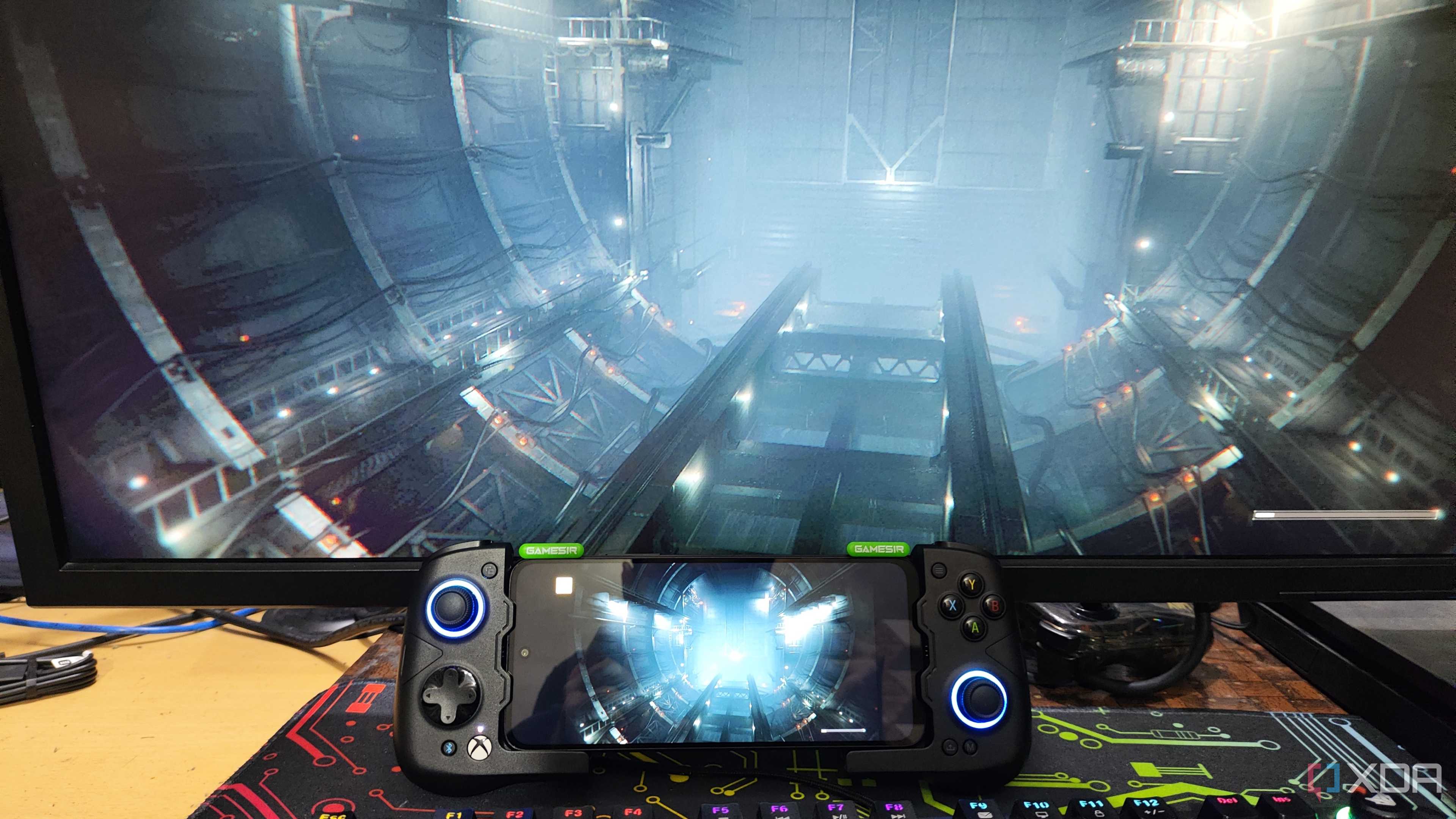 Armored Core VI being streamed to a Poco M6 Pro via Parsec, with the phone attached to a GameSir Aileron X4