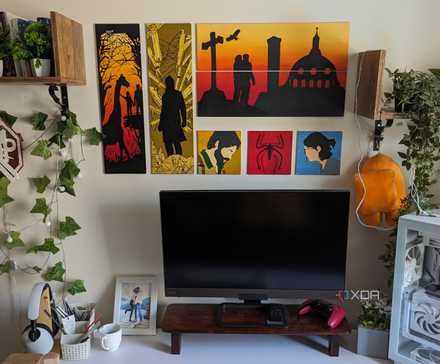 5 Non-Hardware PC Upgrades Often Overlooked for Peak Performance 11 A PC setup with faux plants and leaves and paintings on the wall