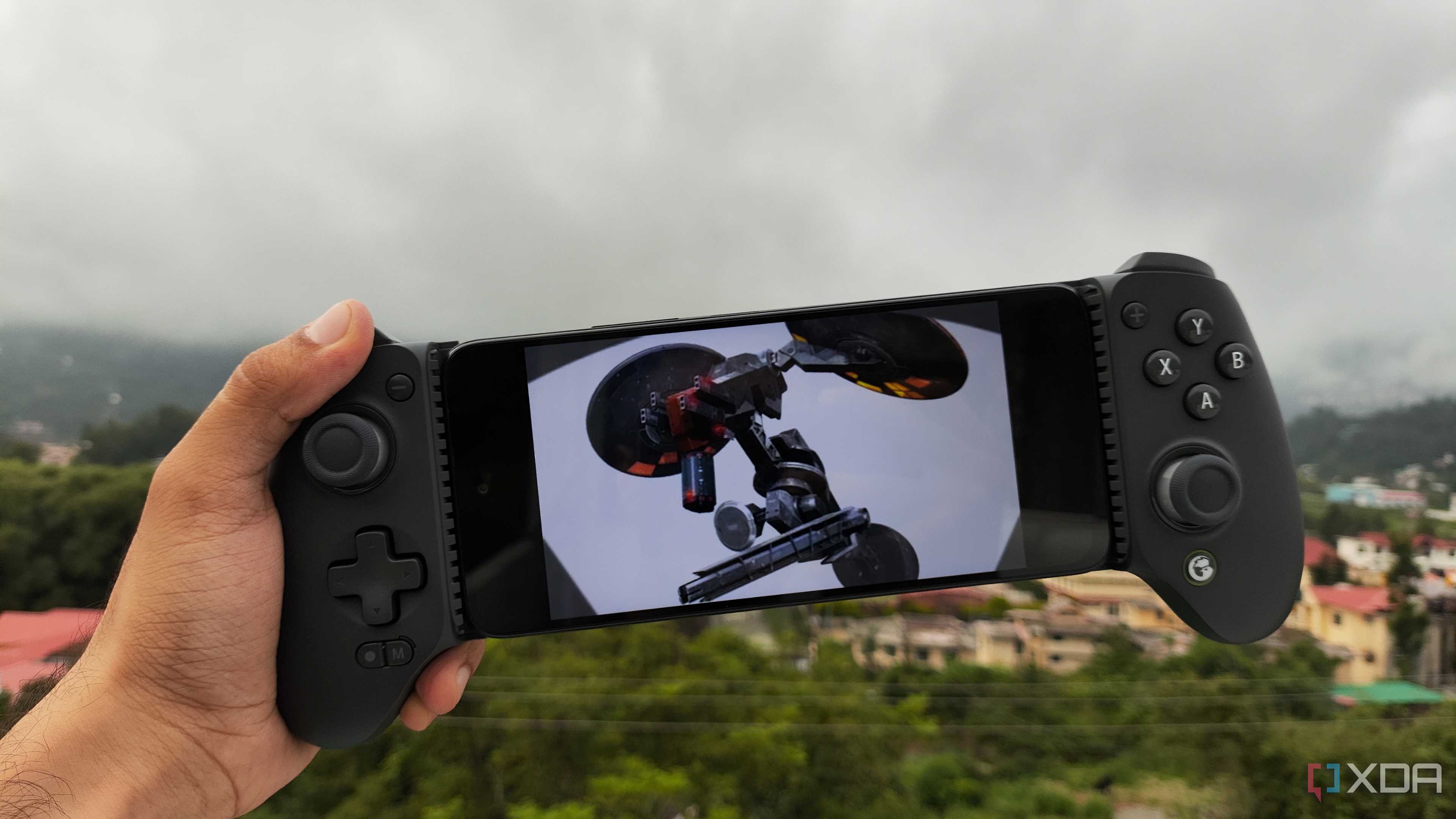 A Poco M6 Pro running Metal Gear Solid: Peace Walker via PPSSPP, with a GameSir Galileo G8+ connected to the phone