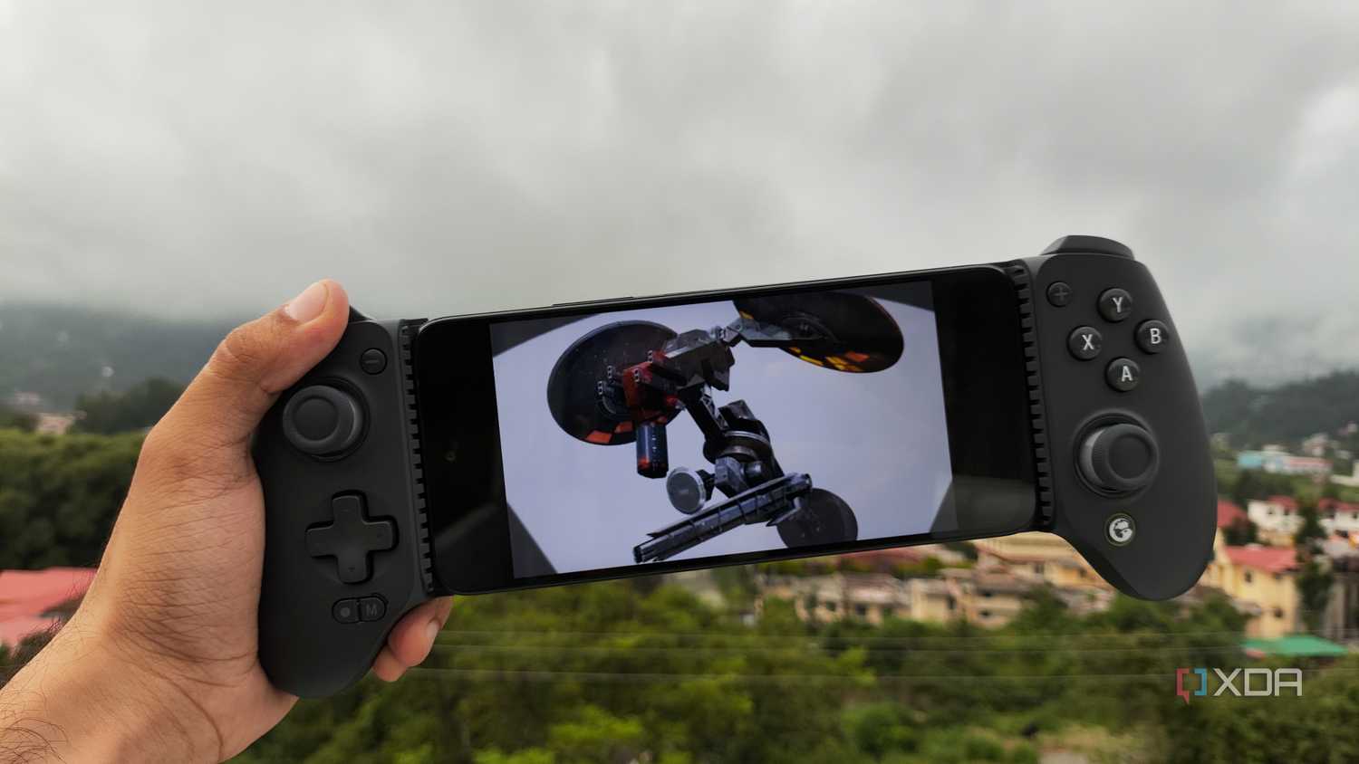 A Poco M6 Pro running Metal Gear Solid: Peace Walker via PPSSPP, with a GameSir Galileo G8+ connected to the phone