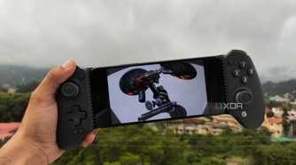 A Poco M6 Pro running Metal Gear Solid: Peace Walker via PPSSPP, with a GameSir Galileo G8+ connected to the phone