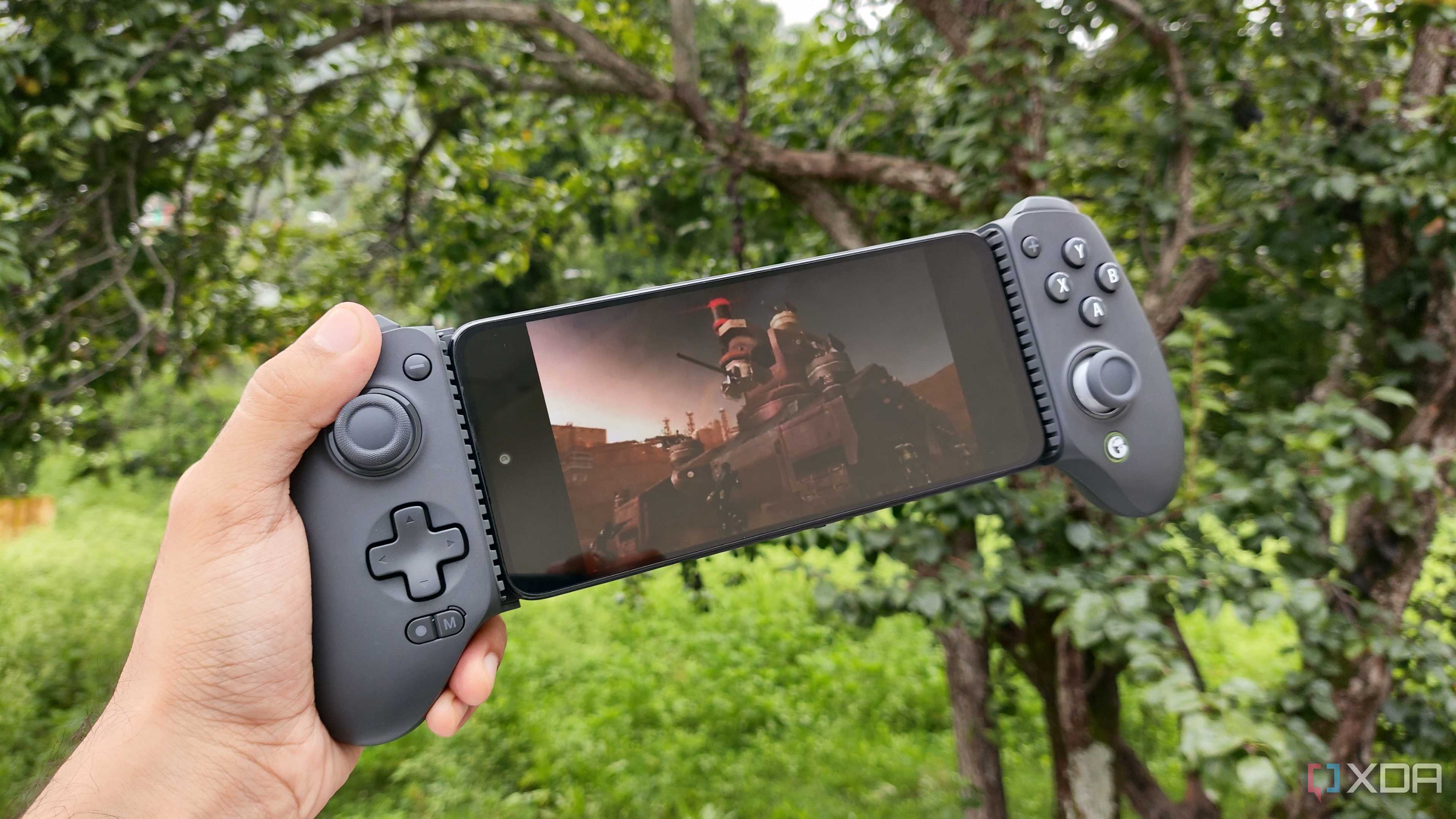 A Poco M6 Pro running Metal Gear Solid: Peace Walker via PPSSPP, with a GameSir Galileo G8+ paired with the phone