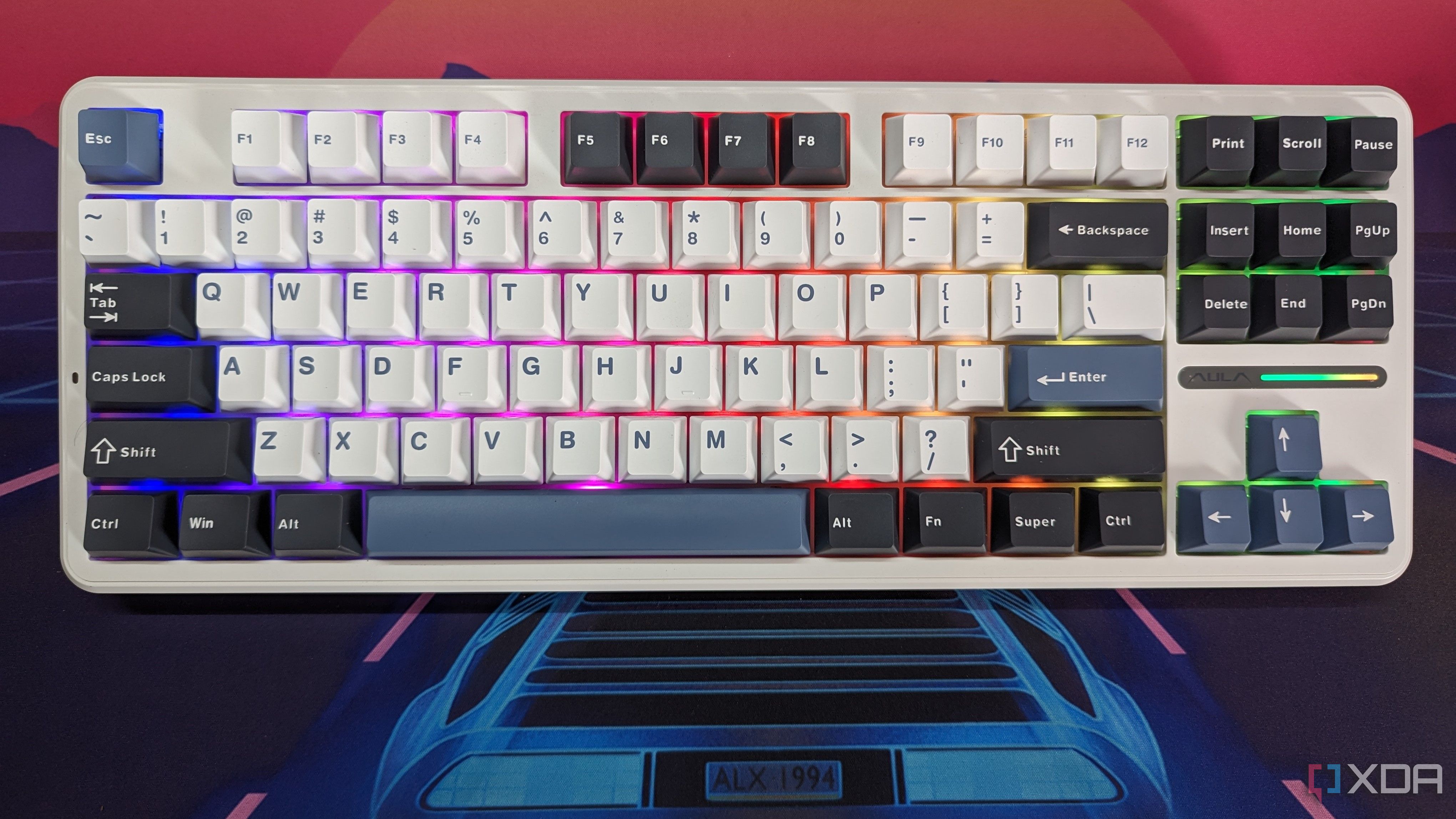 A keyboard shown from the top with RGB lighting on