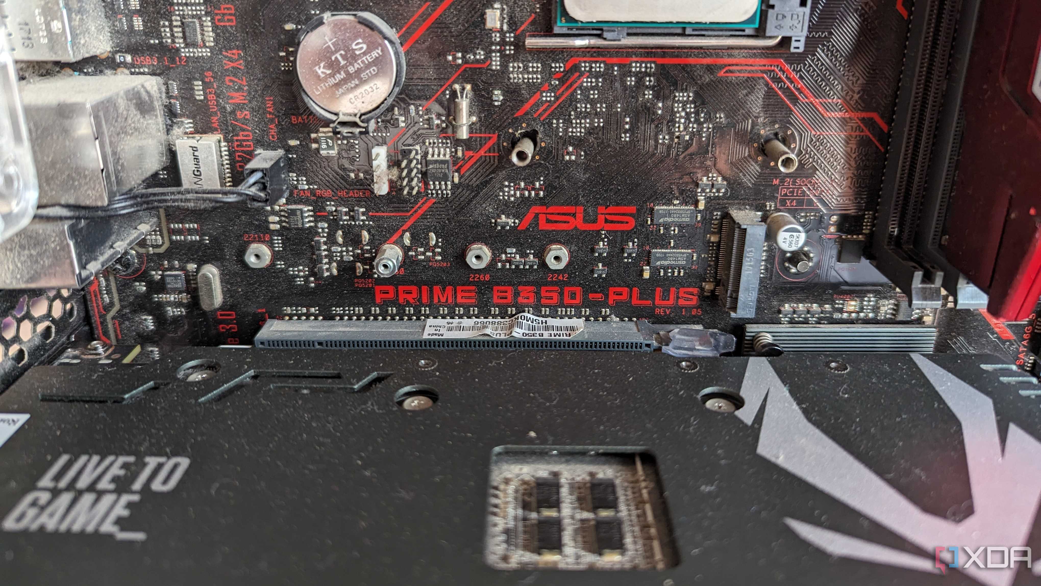 Close up of an Asus Prime B350 motherboard with a GPU installed on it