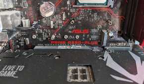 Close up of an Asus Prime B350 motherboard with a GPU installed on it