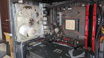 Close-up of the inside of a gaming PC showing the CPU, GPU, motherboard, and RAM