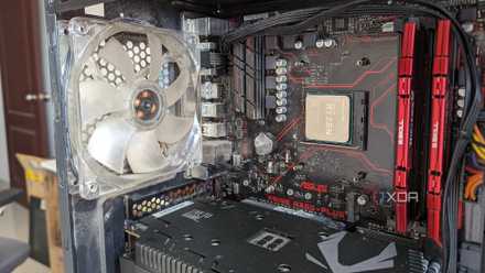 Close-up of the inside of a gaming PC showing the CPU, GPU, motherboard, and RAM
