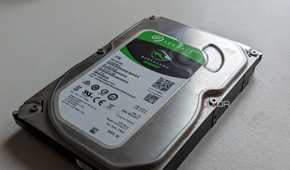 A 1TB Seagate Barracuda HDD on a white surface