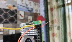 Plugging the jumper cable into the Raspberry Pi 5's GND pin
