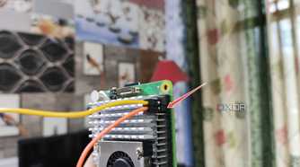 Plugging the jumper cable into the Raspberry Pi 5's GND pin