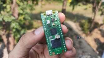 A person holding a Raspberry Pi Pico
