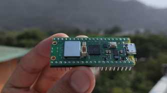 A person holding a Raspberry Pi Pico