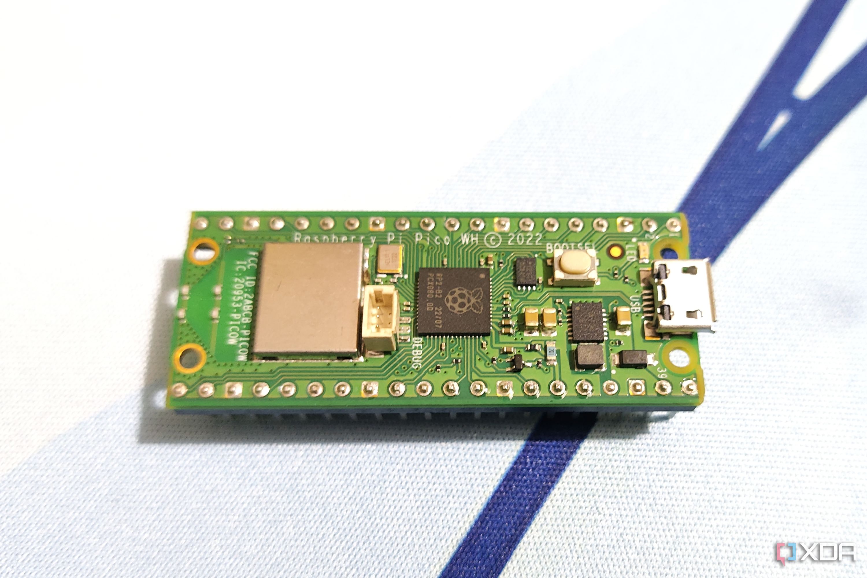 A Raspberry Pi Pico placed on a mousepad