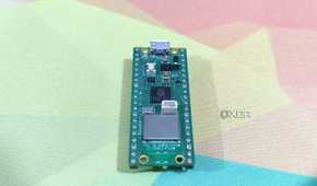 A Raspberry Pi Pico lying on a mousepad