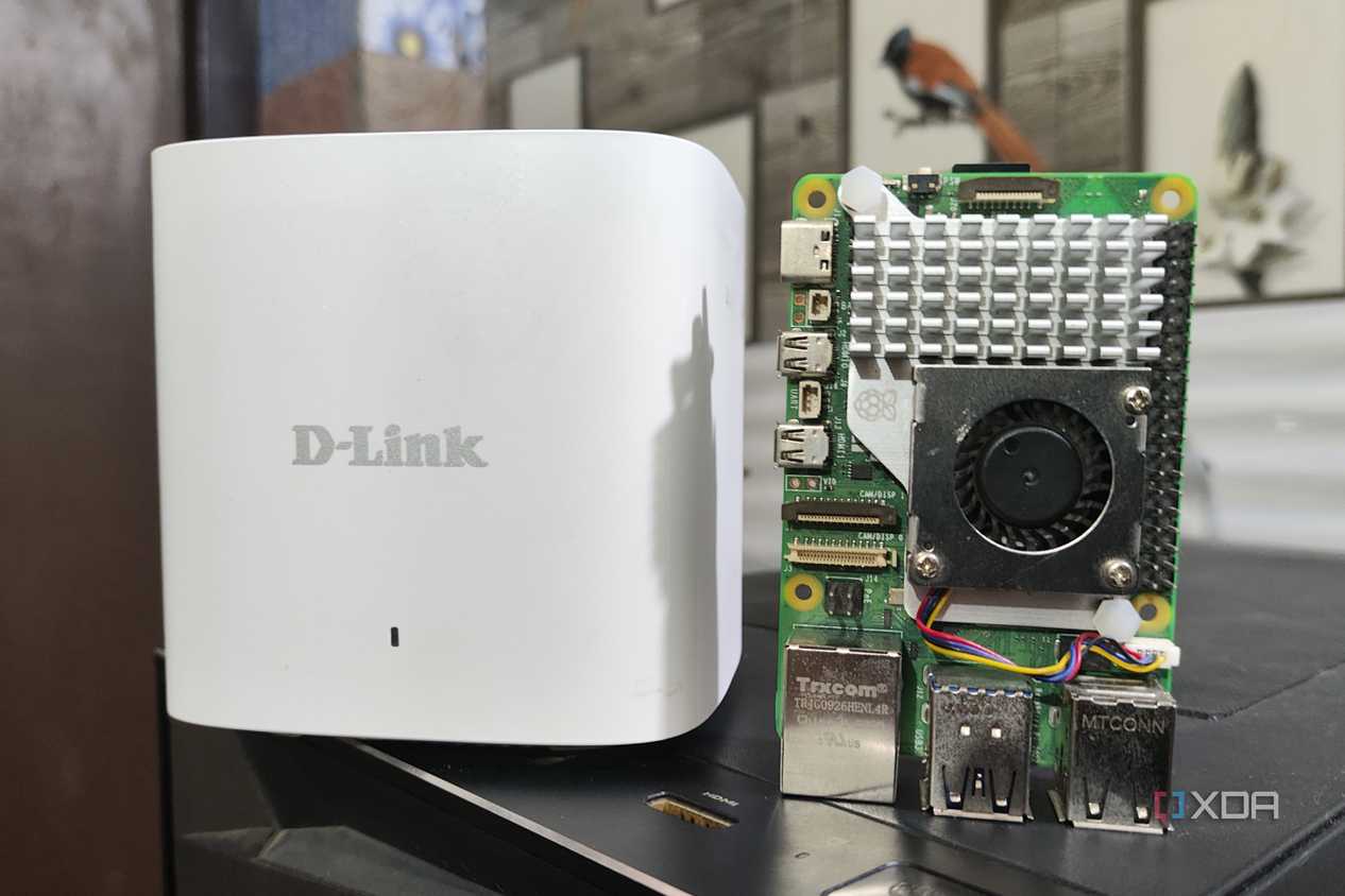 A Raspberry Pi 5 placed next to a D-Link Eagle Pro mesh router