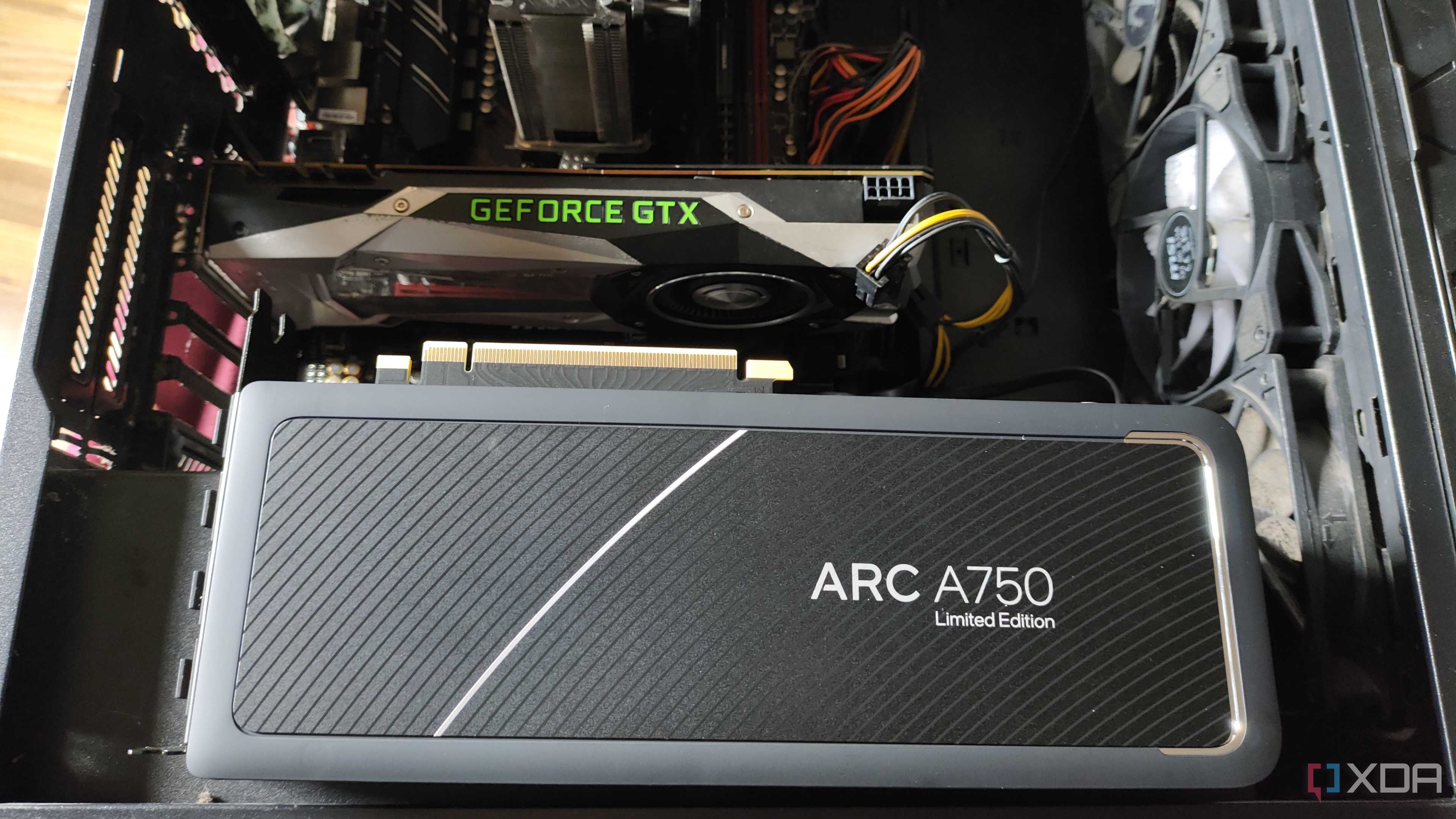 An Intel Arc A750 resting on a case containing a GTX 1080