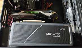 An Intel Arc A750 resting on a case containing a GTX 1080