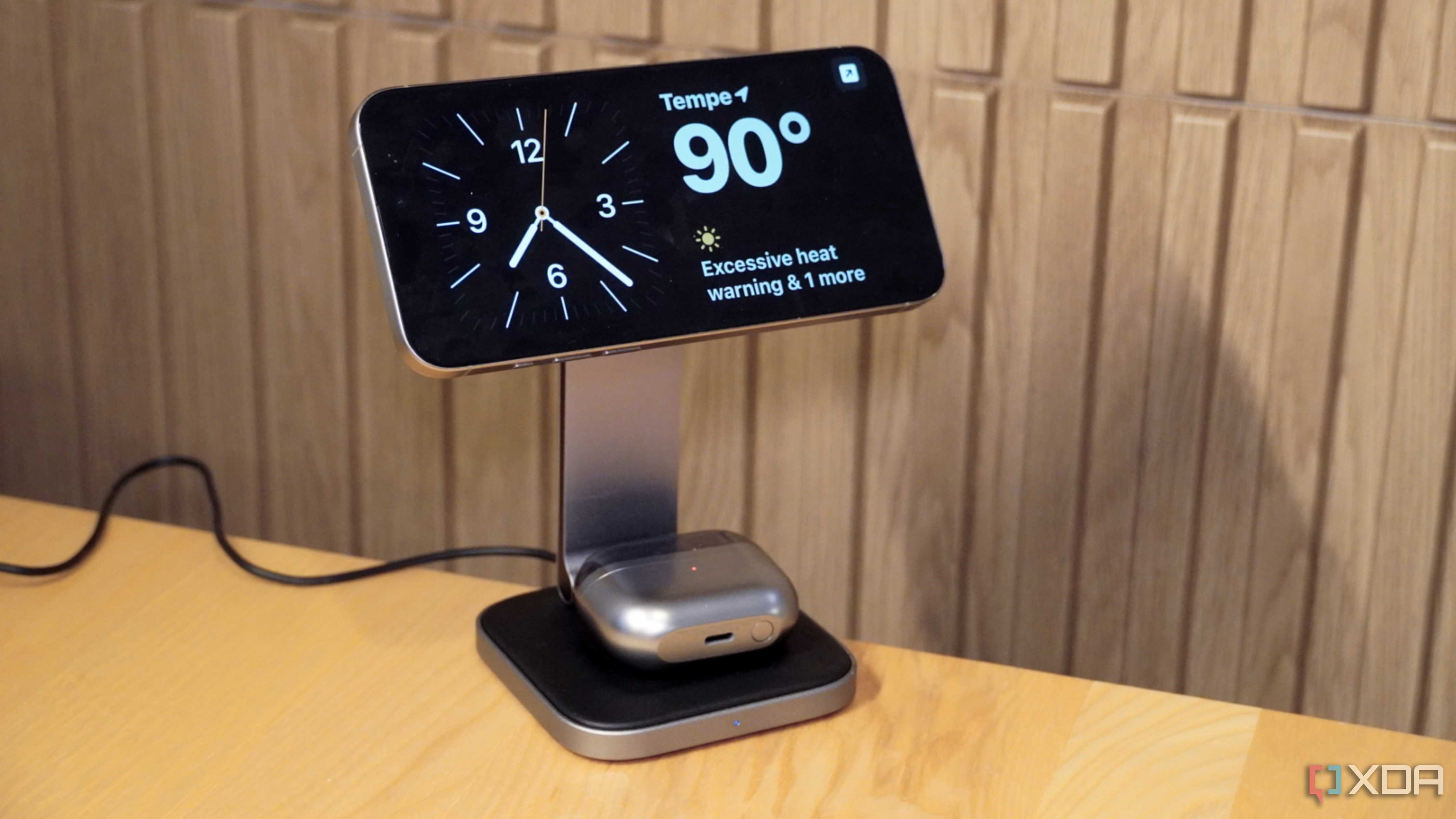 An iPhone 15 Pro Max in StandBy mode on a Satechi 2-in-1 wireless charger.