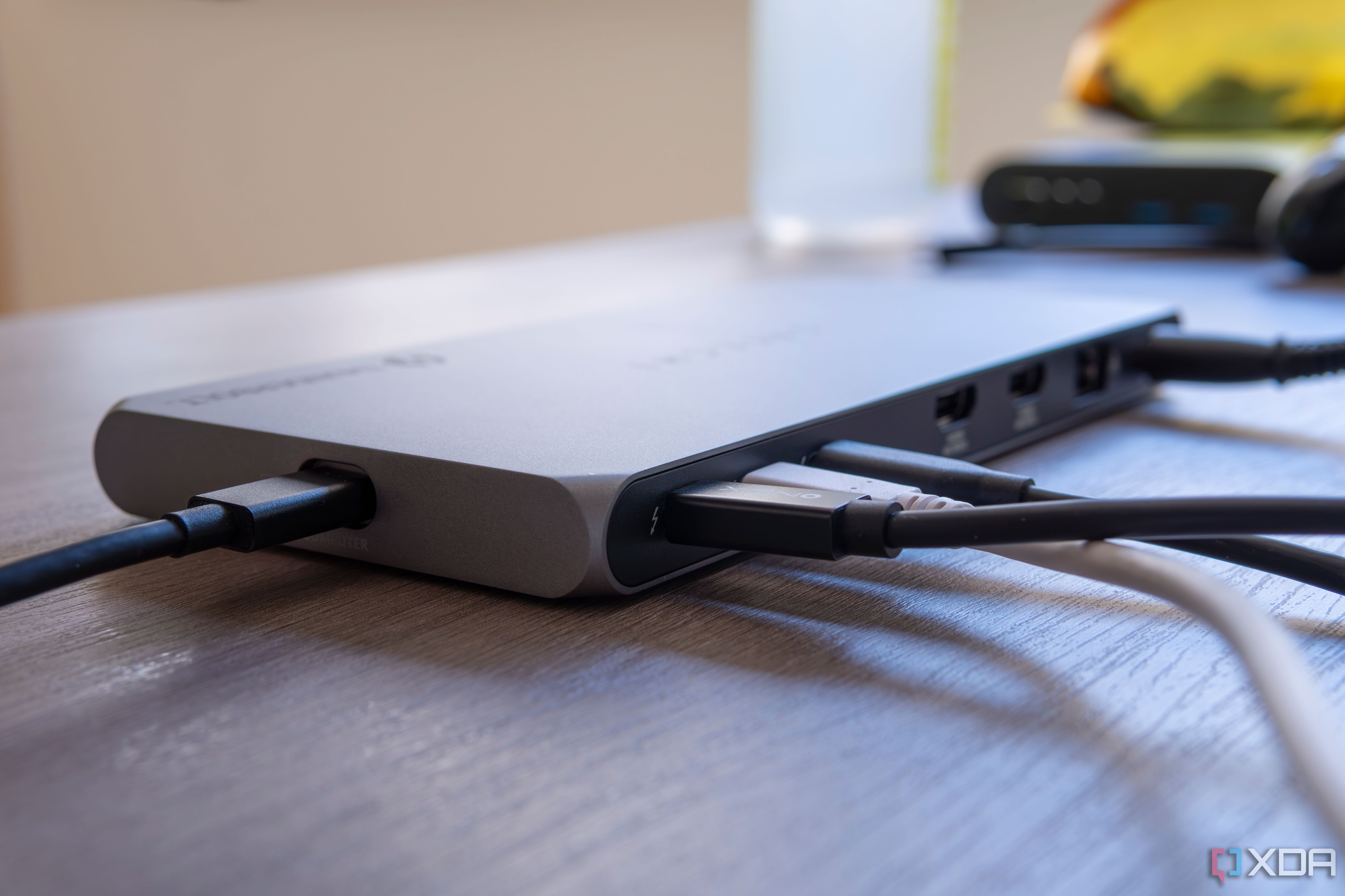 Close-up of the three Thunderbolt ports on the Satechi Thunderbolt 4 Multi-Display Docking Station, each with a peripheral plugged in