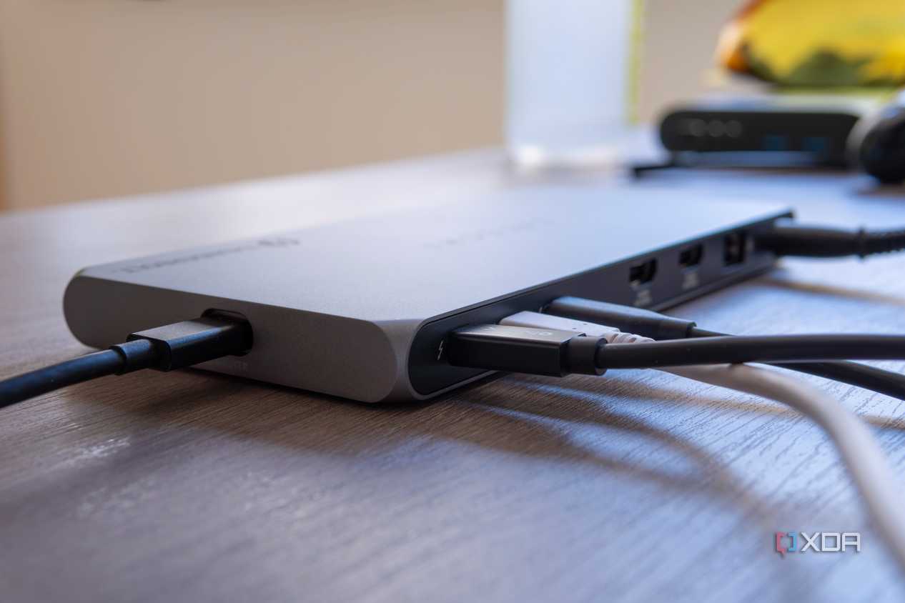 Close-up of the three Thunderbolt ports on the Satechi Thunderbolt 4 Multi-Display Docking Station, each with a peripheral plugged in