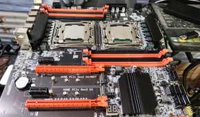 An X99 server motherboard resting on top of a PC