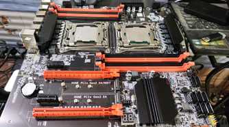 An X99 server motherboard resting on top of a PC