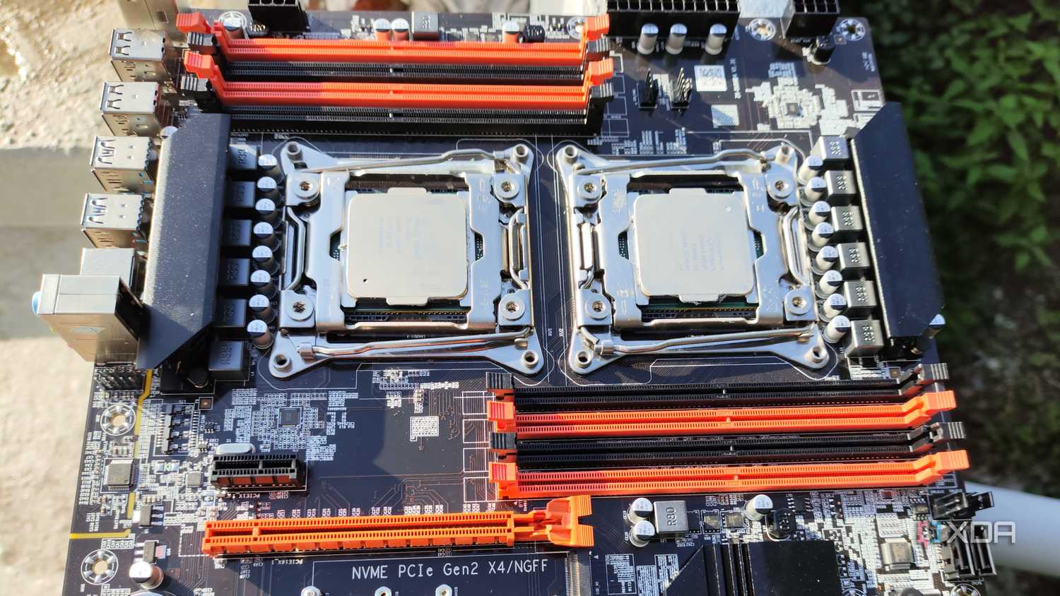 An X99 motherboard featuring two Xeon processors and eight RAM slots