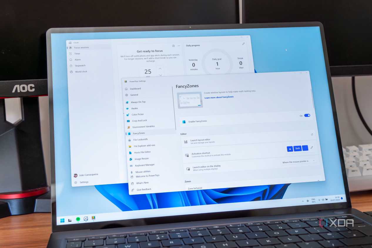A Windows 11 laptop showing the Focus sessions screen and FancyZones in PowerToys