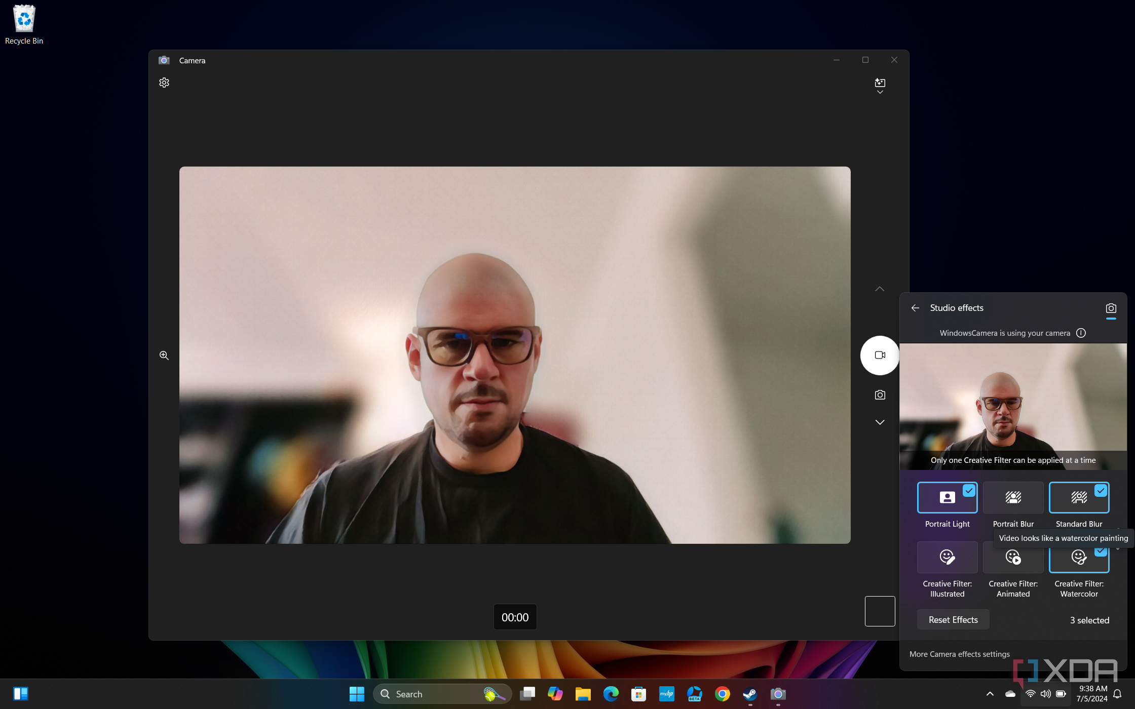 Screenshot of Windows 11 desktop previewing Windows Studio effects in Quick settings, with Portrait light, Standard blur, and a Watercolor filter applied