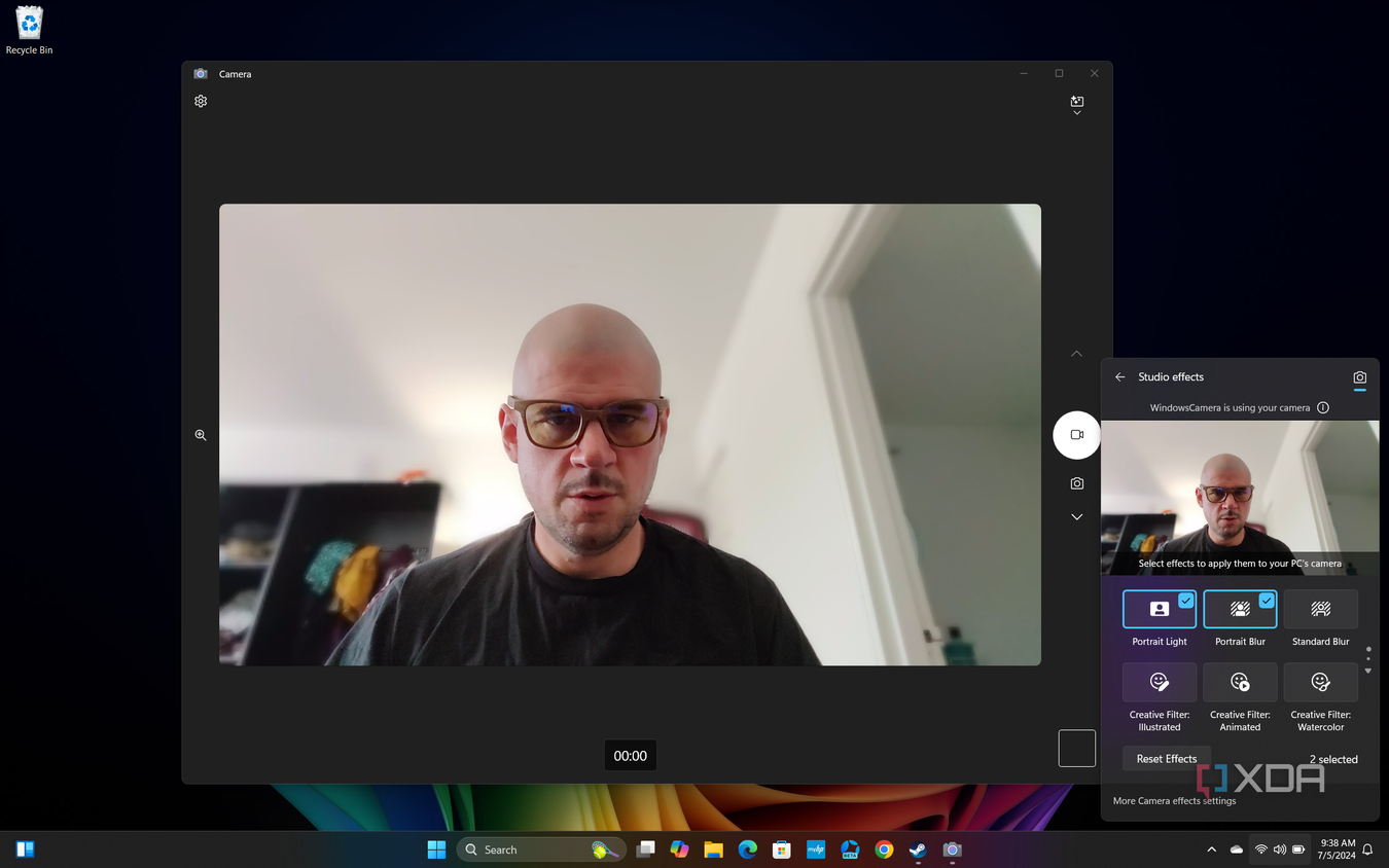 Screenshot of Windows 11 desktop previewing Windows Studio effects in Quick settings, with Portrait light and Portrait blur applied