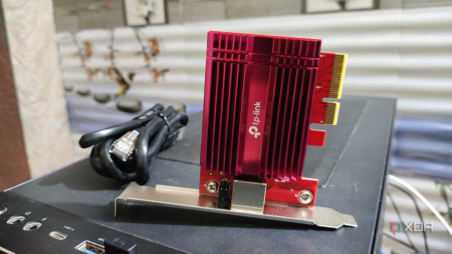 A 10GbE NIC lying on top of a PC case
