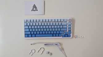 A blue-white keyboard with accessories on a white surface