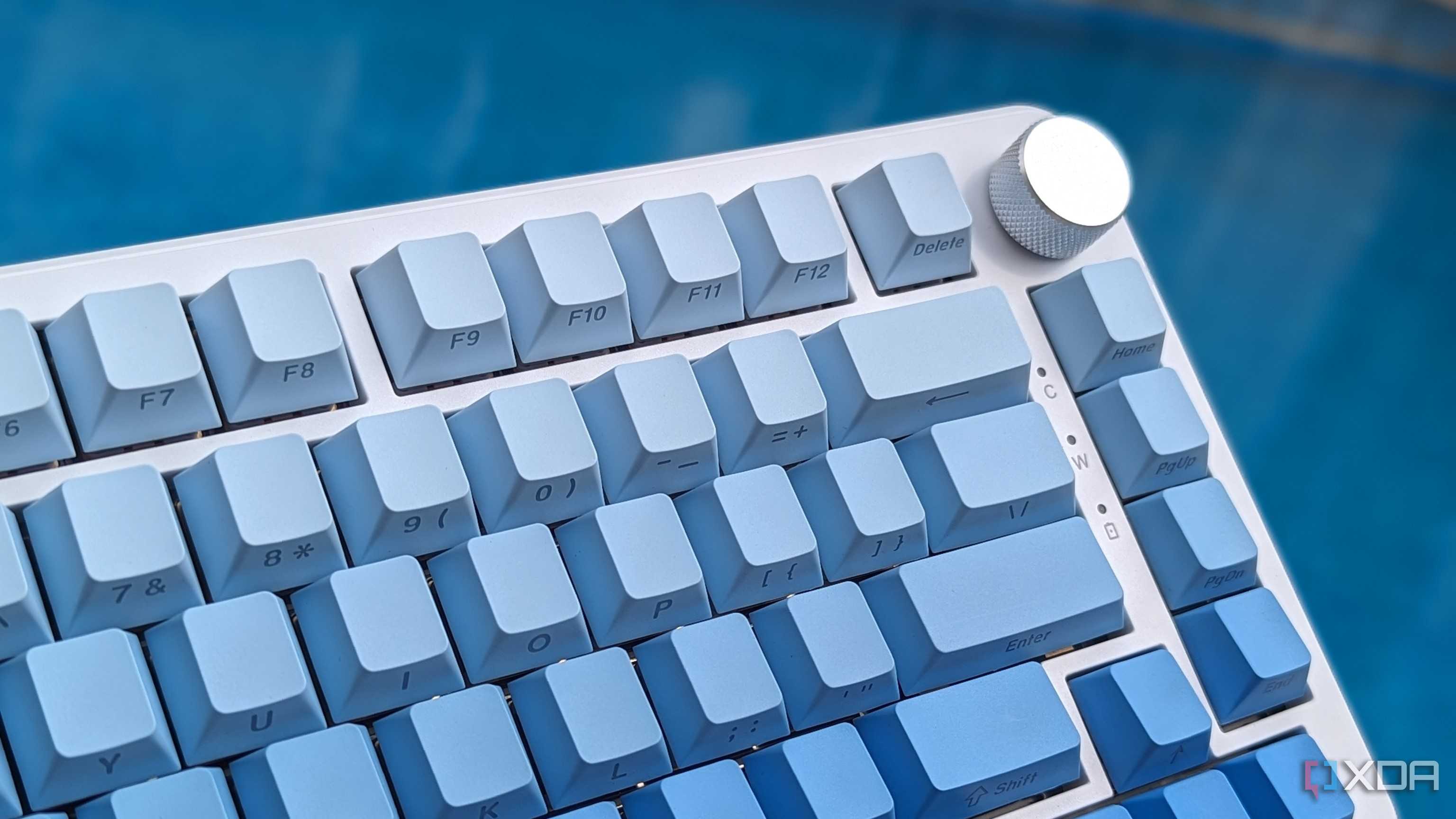 Close-up of a blue-white keyboard against a blue background