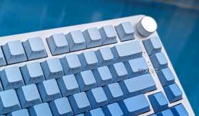 Close-up of a blue-white keyboard against a blue background