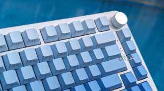 Close-up of a blue-white keyboard against a blue background
